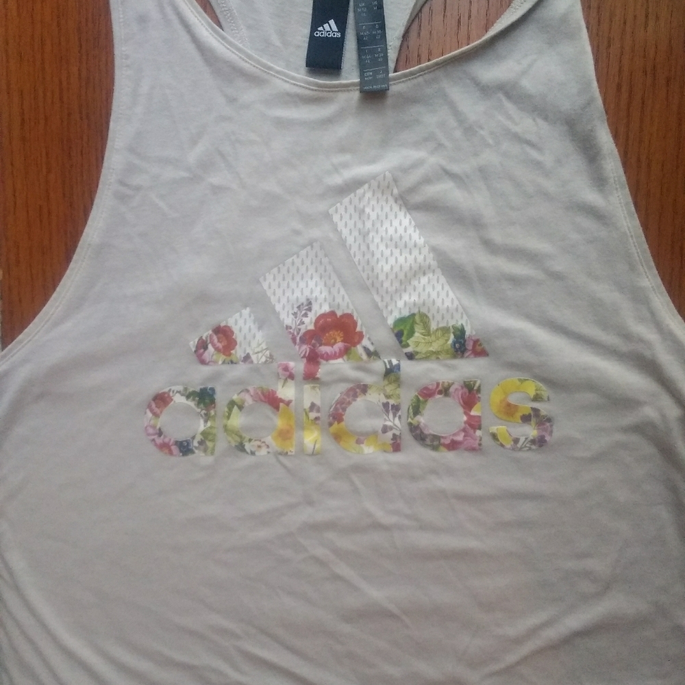 Cream Adidas workout tank with floral letters.